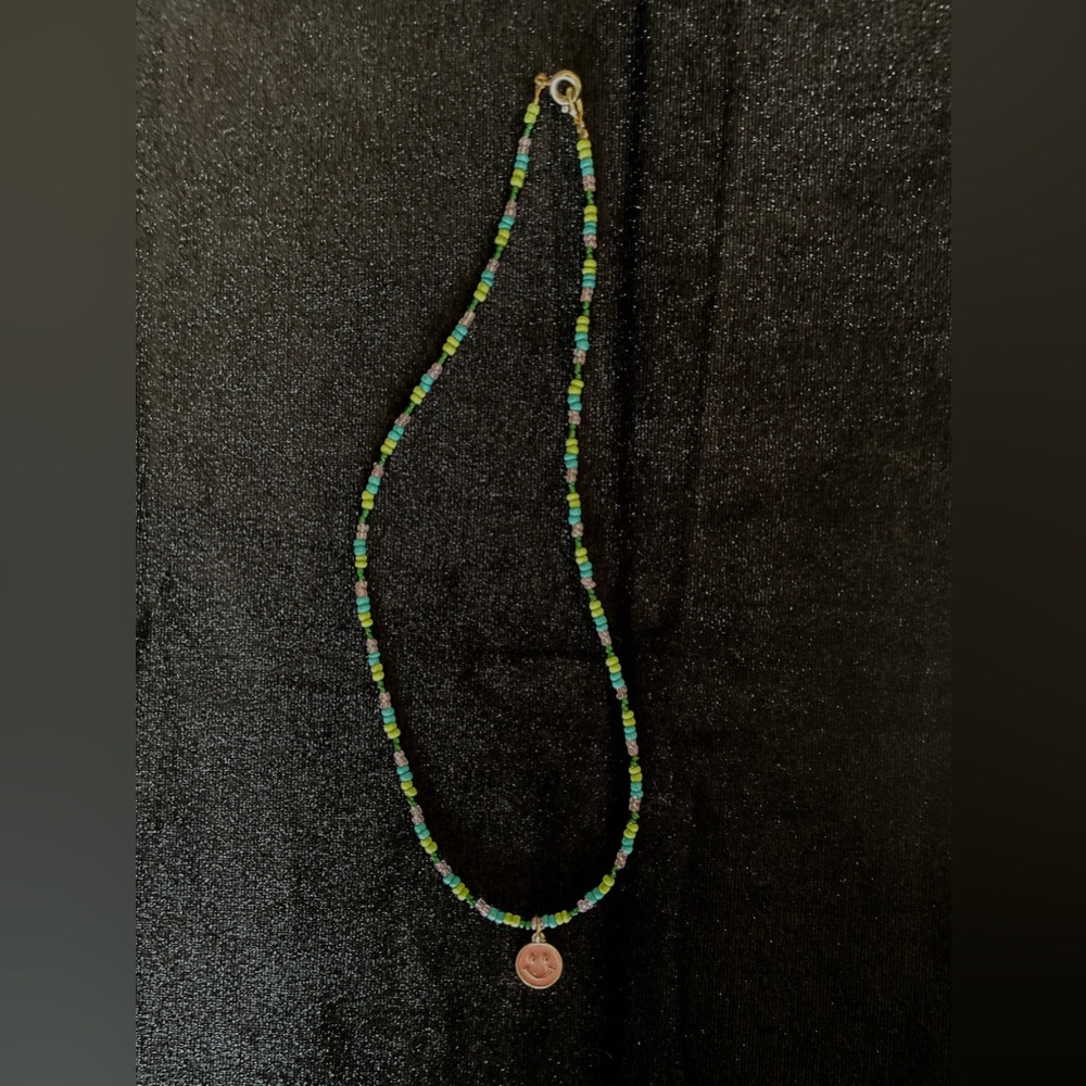 Handmade seed bead necklace with smiley face charm